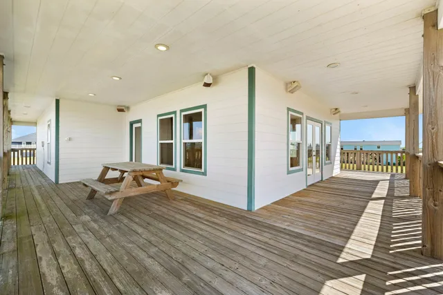 a bathroom with a toilet a sink and a shower curtain