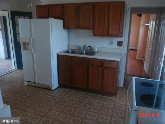 12301 Warner Road Keymar, MD 21757 - Photo 9 of 16 a kitchen with stainless steel appliances a refrigerator and a sink