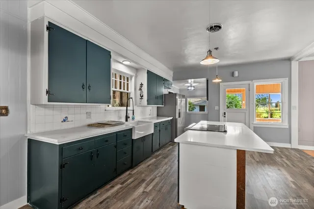 a kitchen with sink cabinets and window