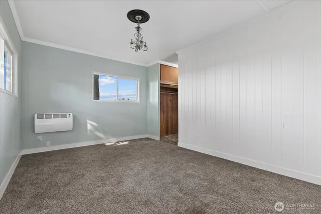 a view of an empty room and a window