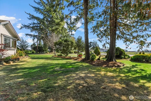 a view of a lake with a big yard