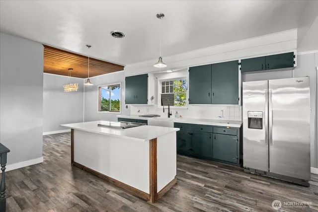 a kitchen with a sink and refrigerator