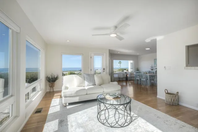 a living room with kitchen island furniture and a kitchen view