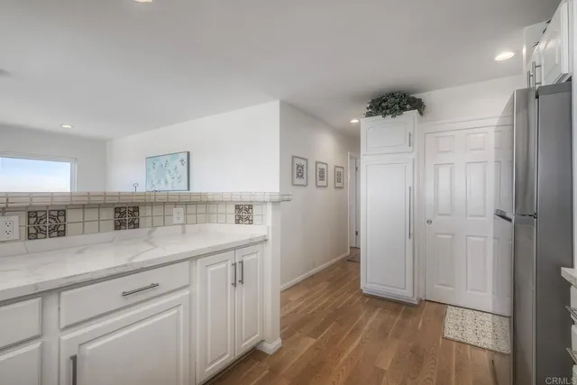 a view of a chairs and table in patio