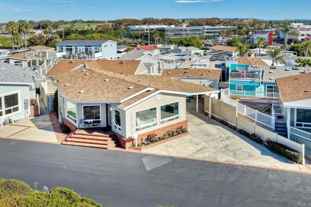 an aerial view of a houses with outdoor space
