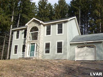 8164 Rinker Road Stroudsburg, PA 18360 - Photo 1 of 5 a front view of a house with a yard