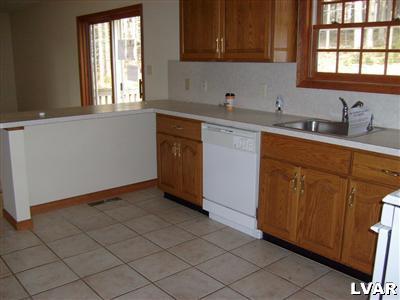 8164 Rinker Road Stroudsburg, PA 18360 - Photo 3 of 5 a kitchen with a sink cabinets and window