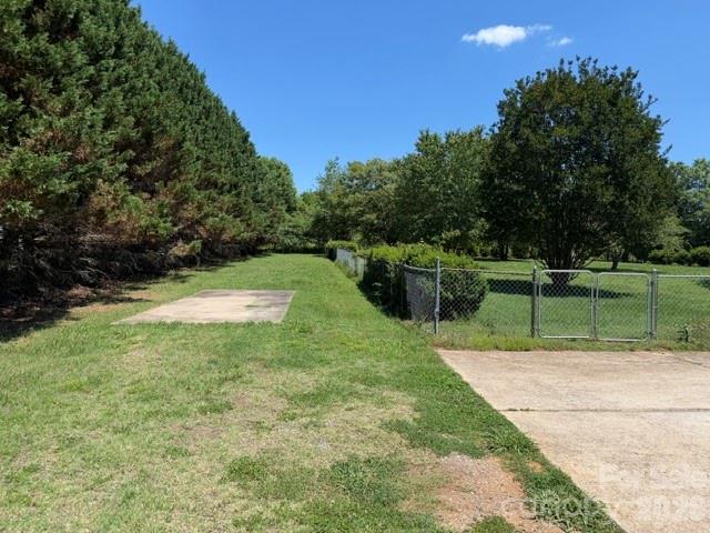 4084 Carpenters Cove Road Claremont, NC 28610 - Photo 26 of 27 a view of a backyard with green space