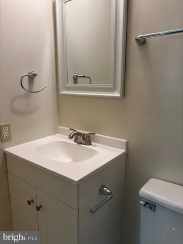 a kitchen with granite countertop a stove a sink and a microwave