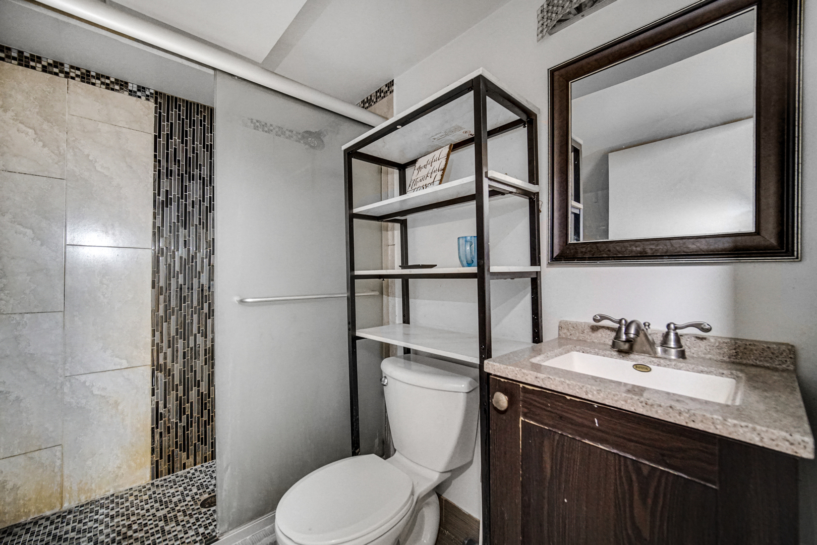 2564 Plainfield Road Joliet, IL 60435 - Photo 12 of 20 a bathroom with a sink a toilet and shower