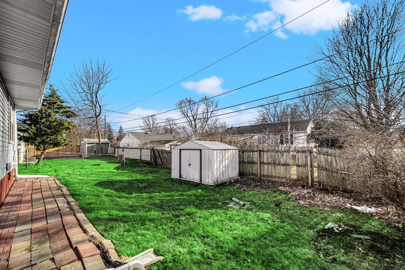 2564 Plainfield Road Joliet, IL 60435 - Photo 19 of 20 a view of a backyard with plants and a garden