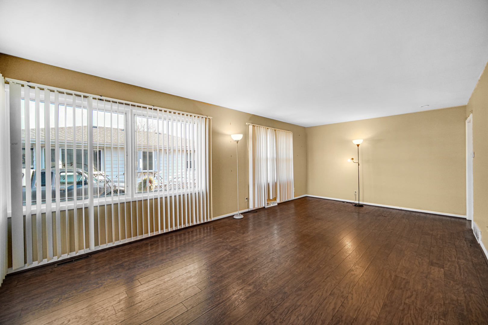 2564 Plainfield Road Joliet, IL 60435 - Photo 5 of 20 an empty room with wooden floor and windows