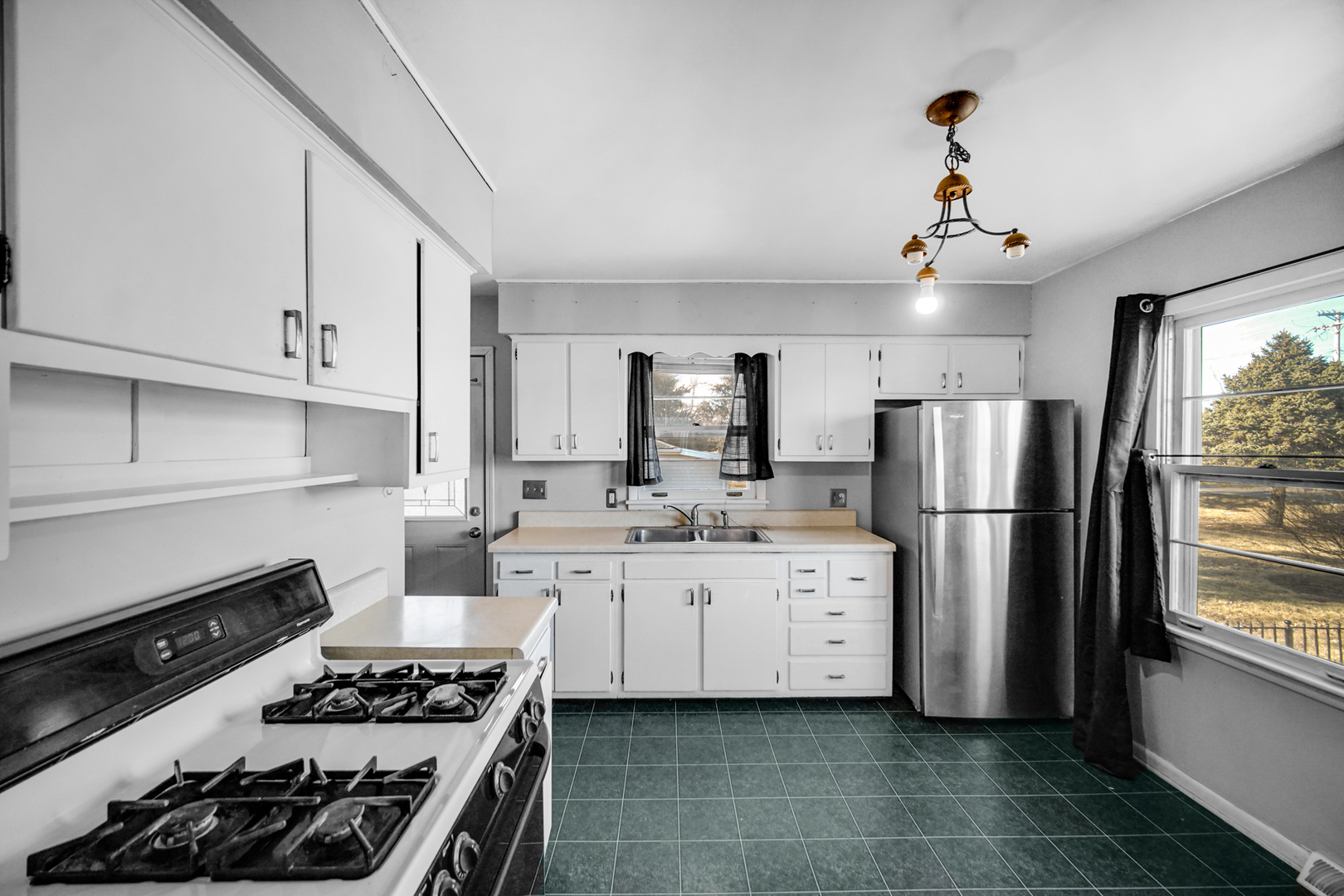 2564 Plainfield Road Joliet, IL 60435 - Photo 6 of 20 a kitchen with stainless steel appliances a stove a sink and a refrigerator