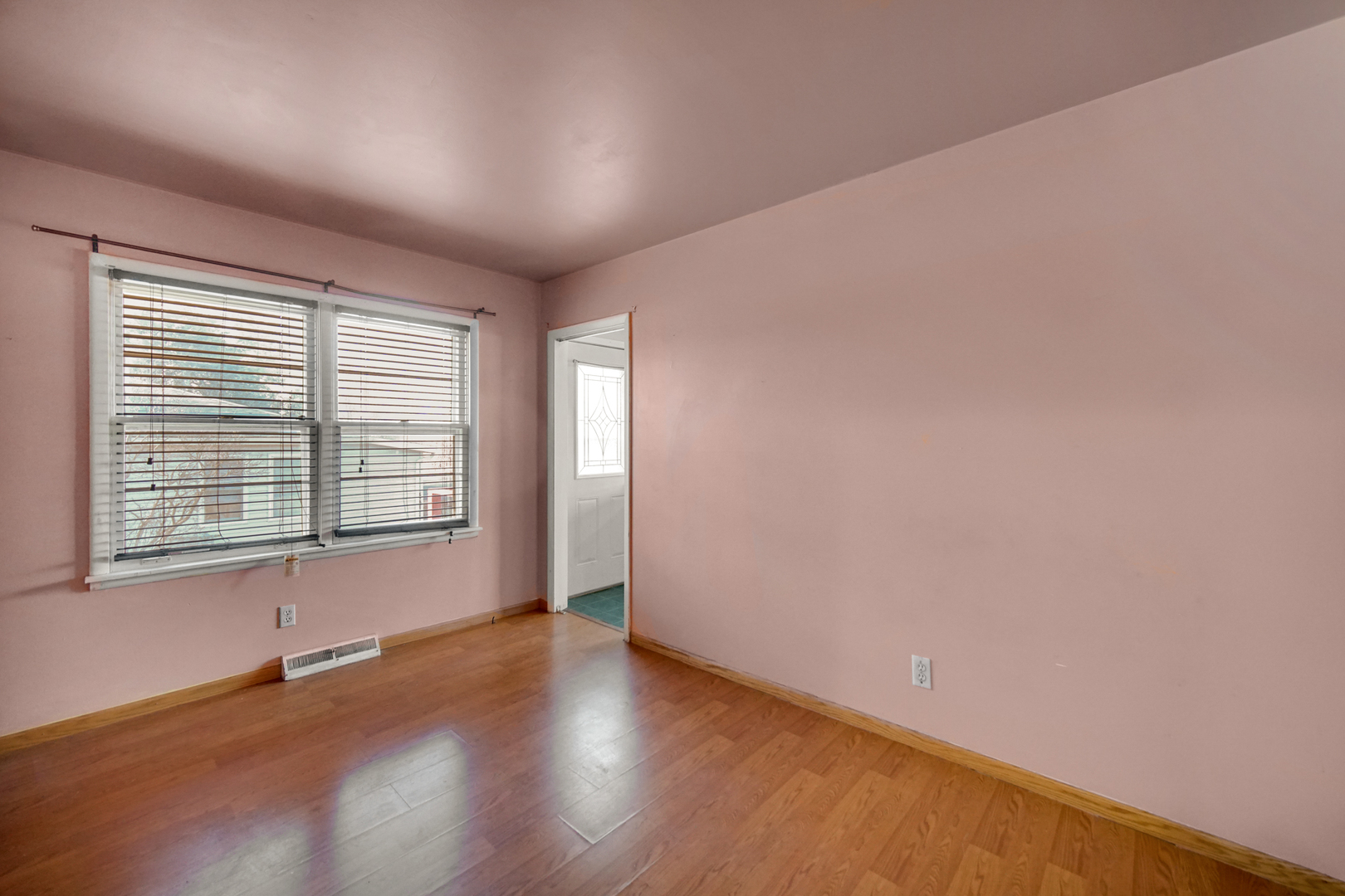 2564 Plainfield Road Joliet, IL 60435 - Photo 9 of 20 an empty room with wooden floor and windows