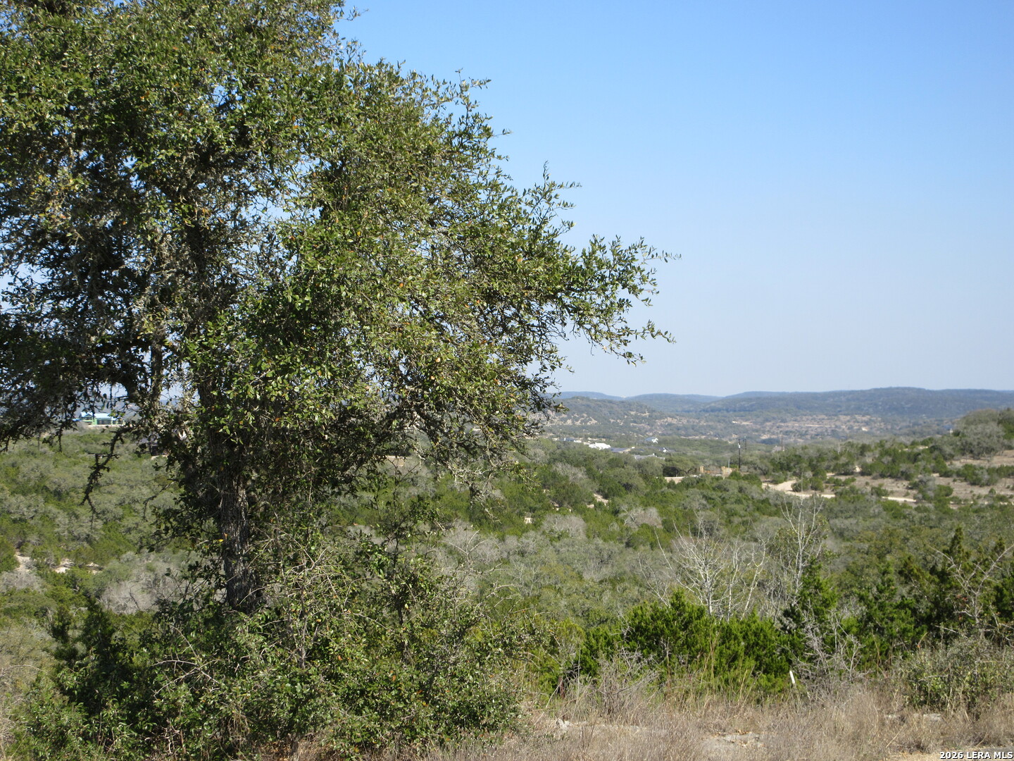 Lot 13 Canyon Rim Helotes, TX 78023 - Photo 1 of 5 a view of a city with lush green forest