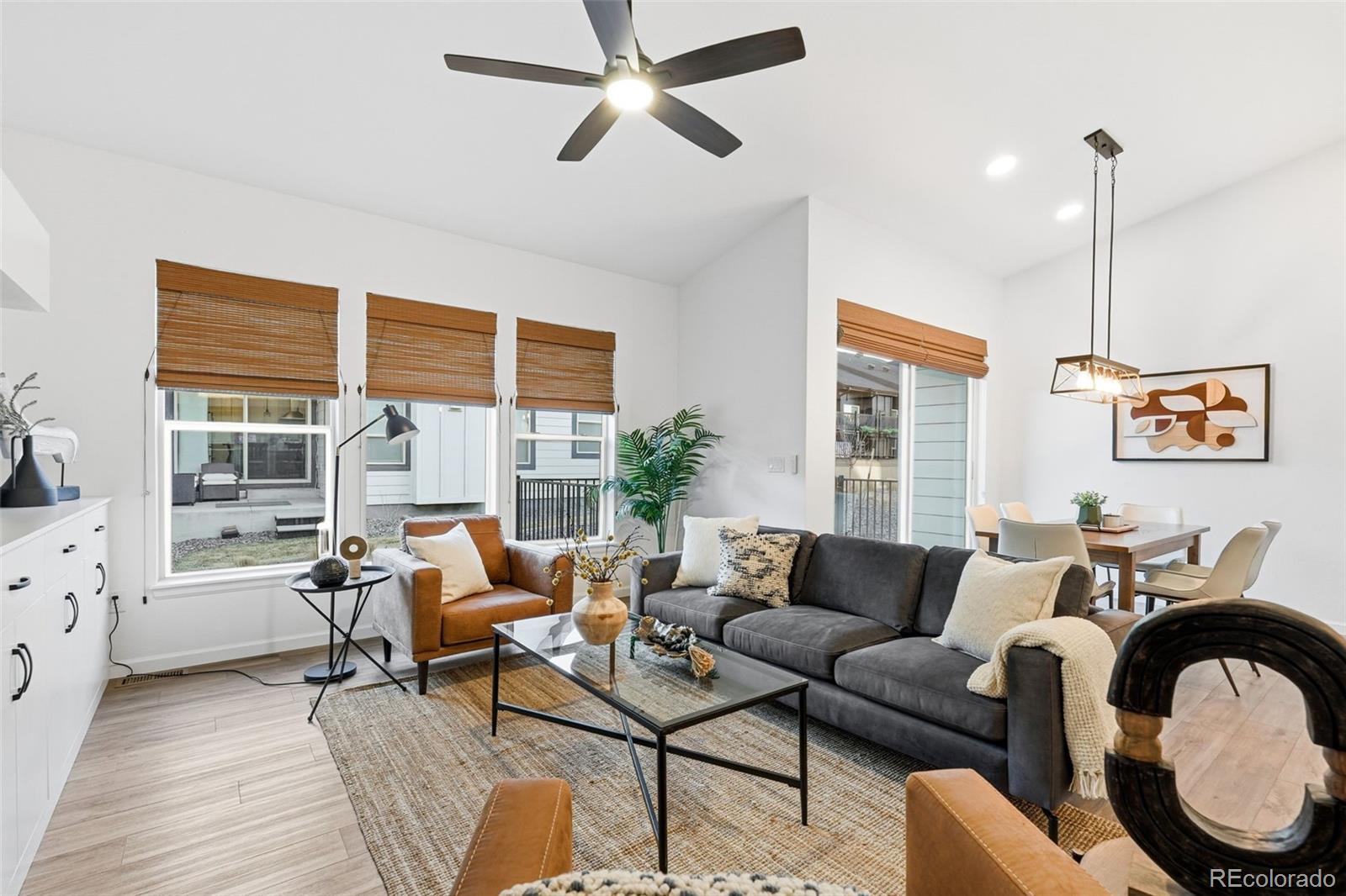 8283 South Queen Street Littleton, CO 80127 - Photo 12 of 46 a living room with furniture and a window