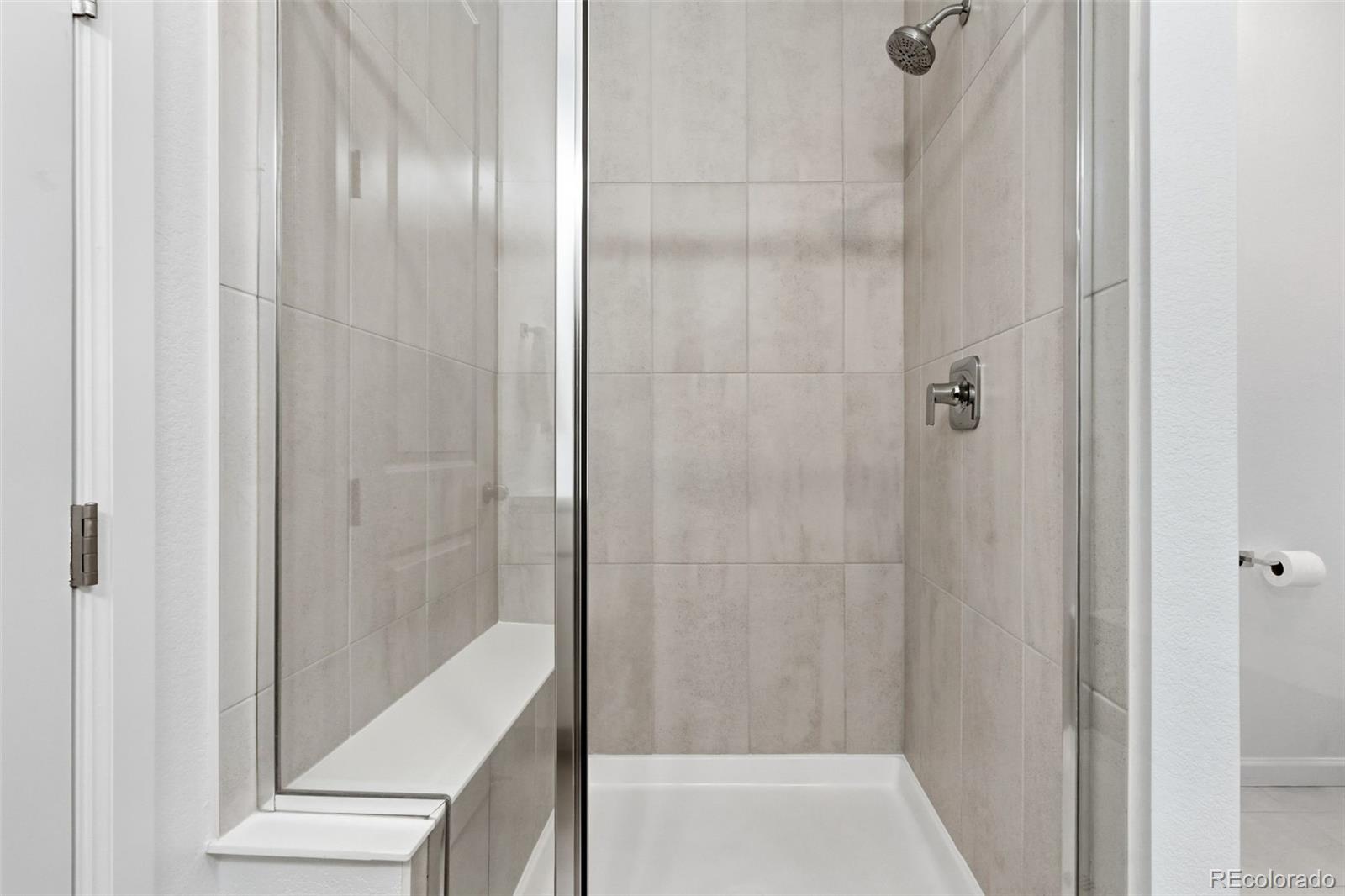 8283 South Queen Street Littleton, CO 80127 - Photo 25 of 46 a bathroom with a bathtub