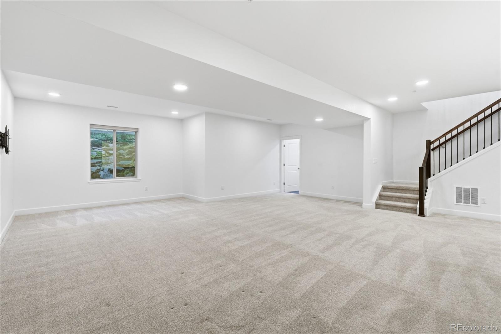 8283 South Queen Street Littleton, CO 80127 - Photo 32 of 46 a view of an empty room with a window