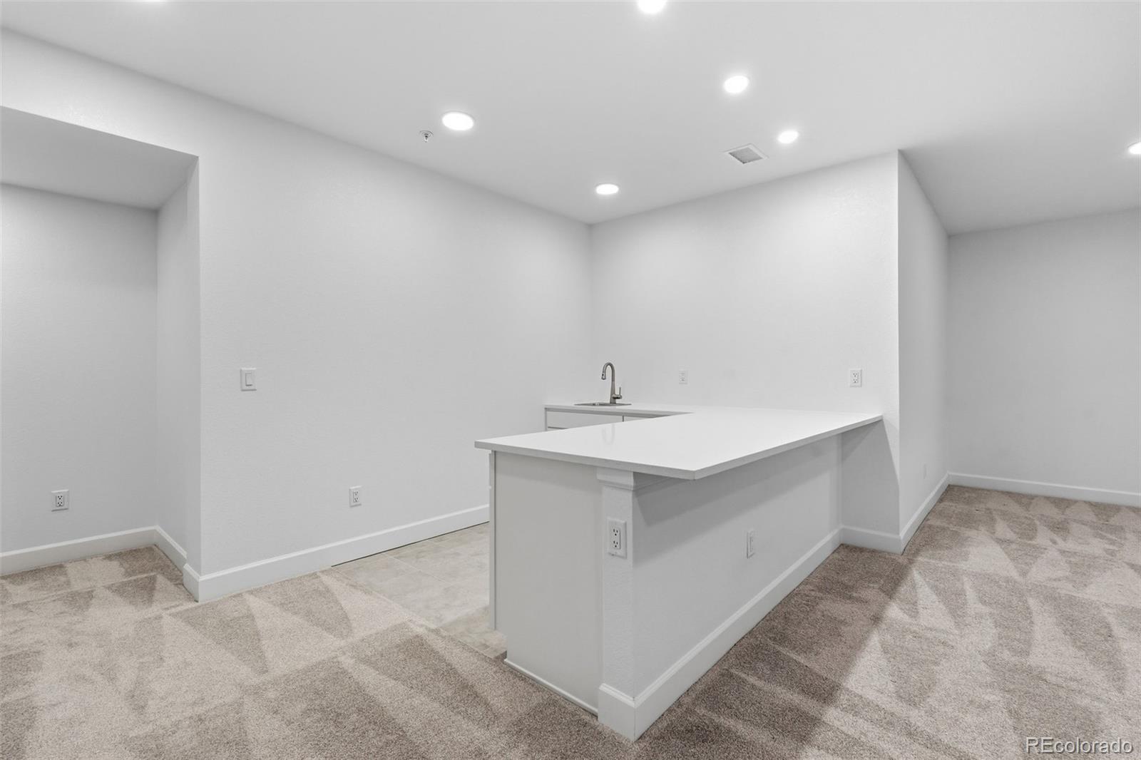 8283 South Queen Street Littleton, CO 80127 - Photo 33 of 46 a bathroom with a sink vanity and a mirror