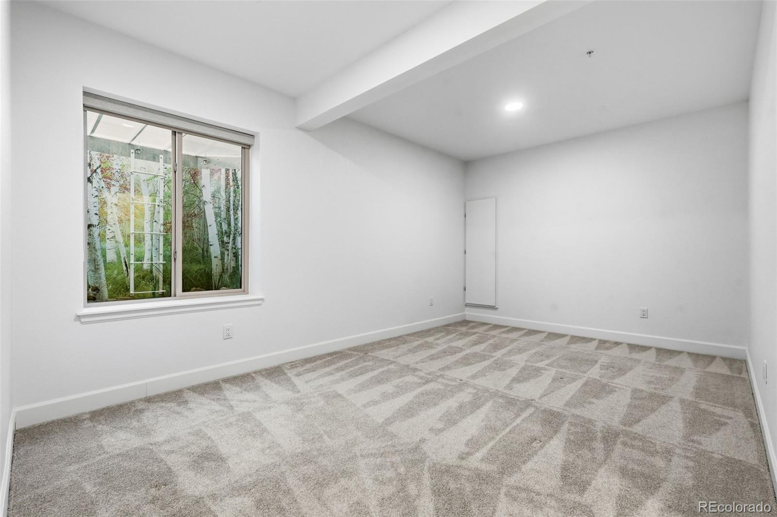 8283 South Queen Street Littleton, CO 80127 - Photo 37 of 46 a view of empty room with window