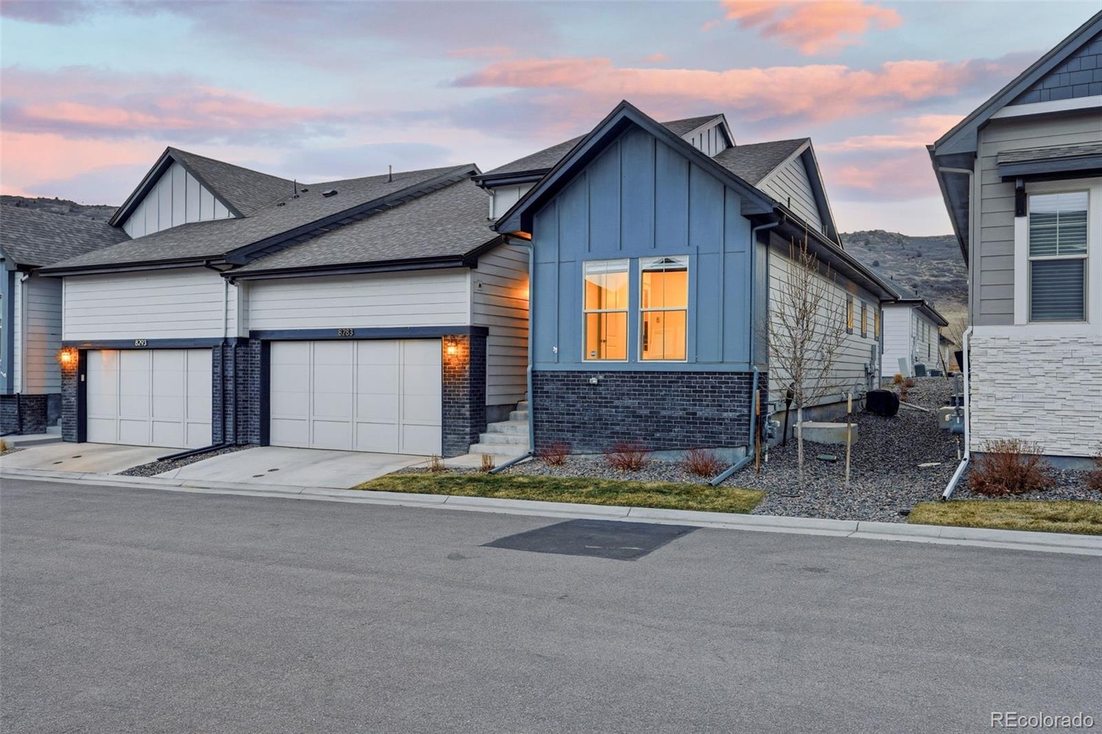 8283 South Queen Street Littleton, CO 80127 - Photo 45 of 46 a front view of a house with a garage