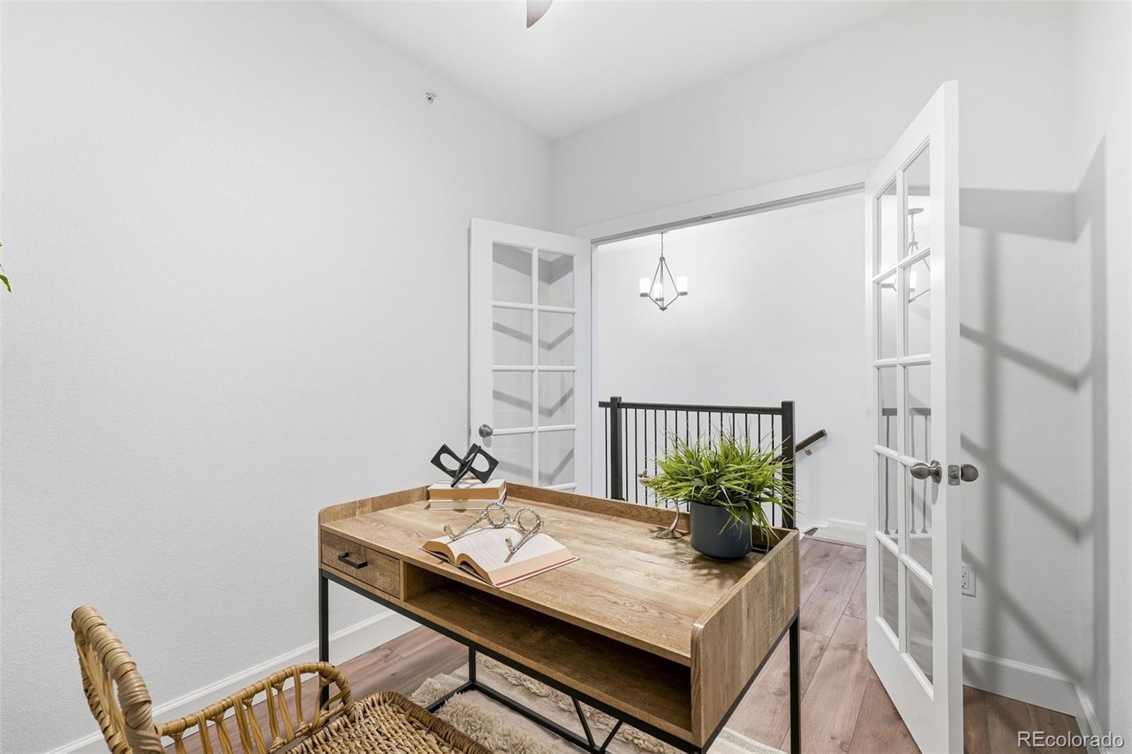 8283 South Queen Street Littleton, CO 80127 - Photo 9 of 46 a view of a workspace with furniture