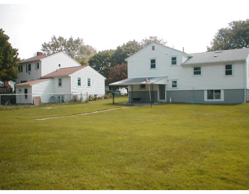 48 Miriam Road Waltham, MA 02451 - Photo 5 of 10 a front view of a house with a big yard