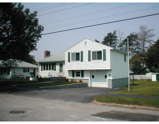 48 Miriam Road Waltham, MA 02451 - Photo 8 of 10 a front view of a house with a yard