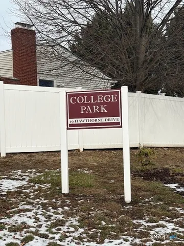 a sign on the side of a street