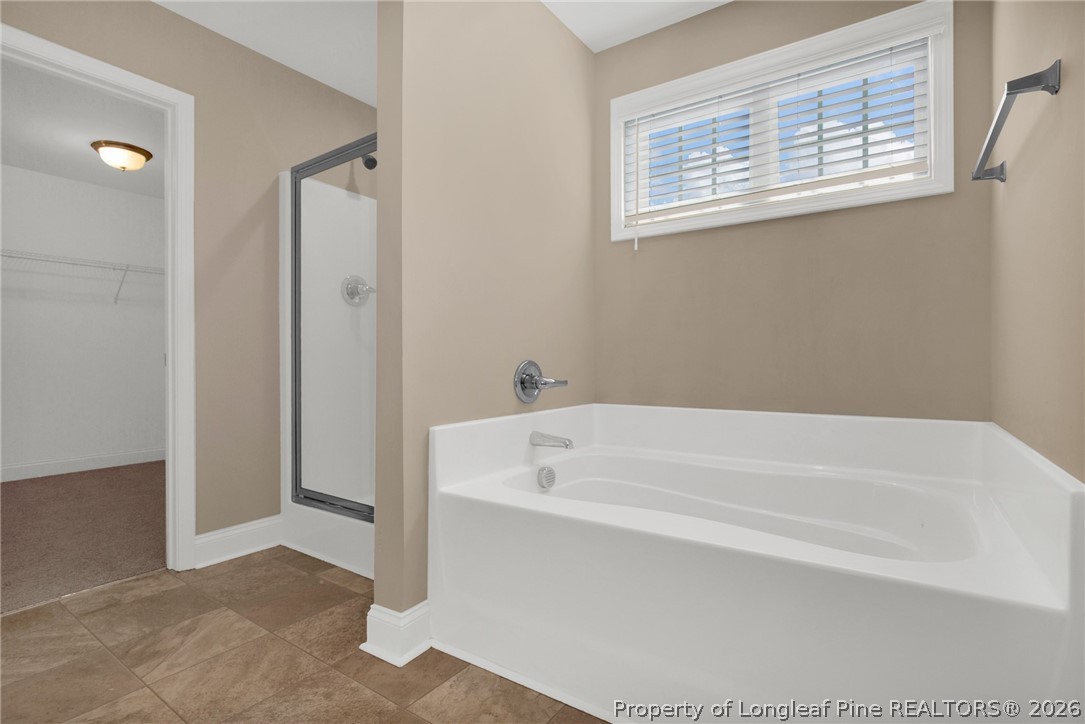 448 Pittfield Run Cameron, NC 28326 - Photo 35 of 43 a white bath tub sitting next to a white cabinet