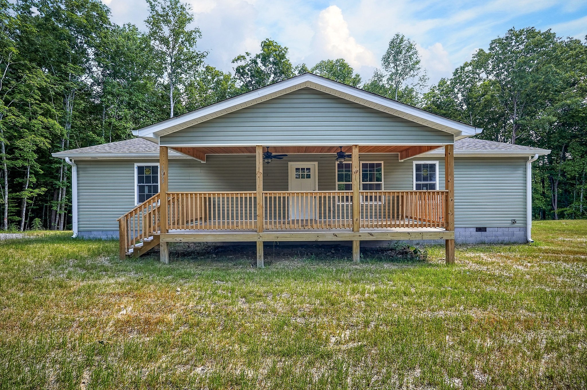 1053 Benton Tidwell Road Hilham, TN 38568 - Photo 23 of 39 a view of a house and a yard