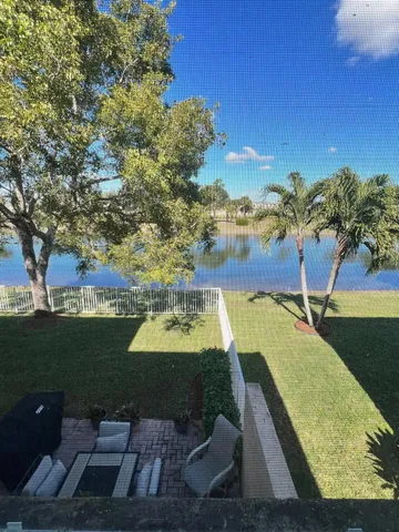 a bedroom with a bed and a ceiling fan