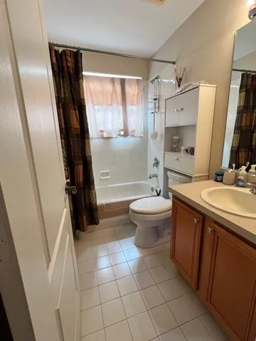 a kitchen with stainless steel appliances kitchen island granite countertop a refrigerator and a sink