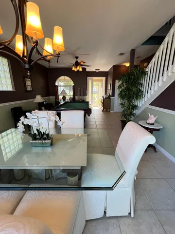 a kitchen with stainless steel appliances granite countertop a sink and a stove