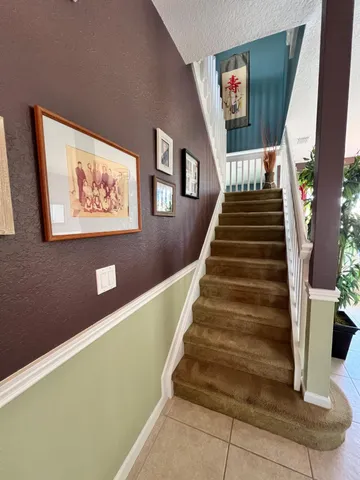 a bathroom with a sink a toilet a mirror and shower