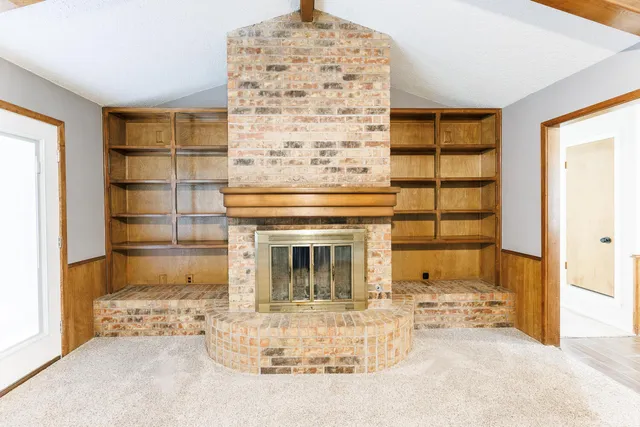 a view of a livingroom with shelves