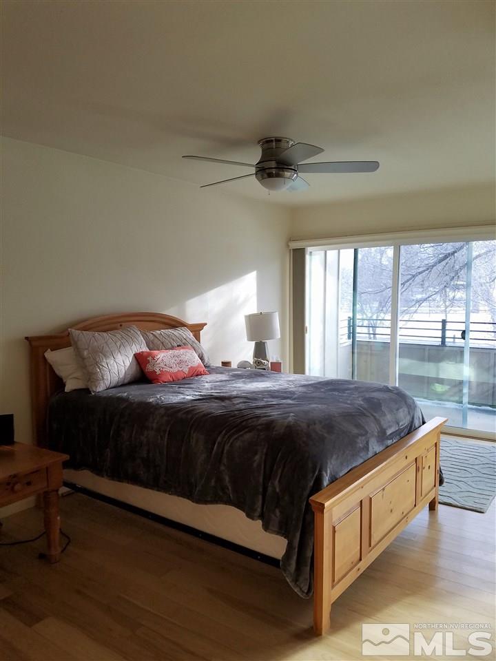 1316 Jones Street Reno, NV 89503 - Photo 9 of 16 a bed sitting in a bedroom next to a window
