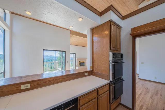 a kitchen with a refrigerator and countertop