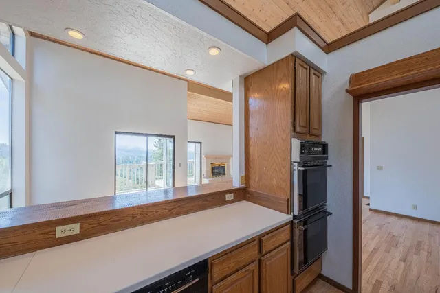 a kitchen with a refrigerator and countertop