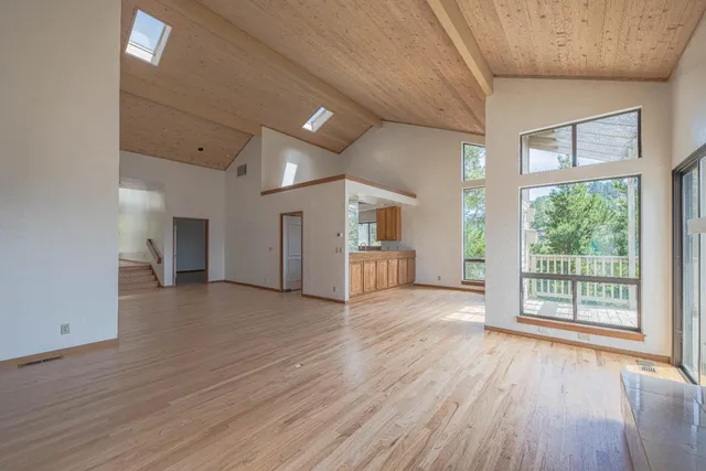 a view of a livingroom with wooden floor