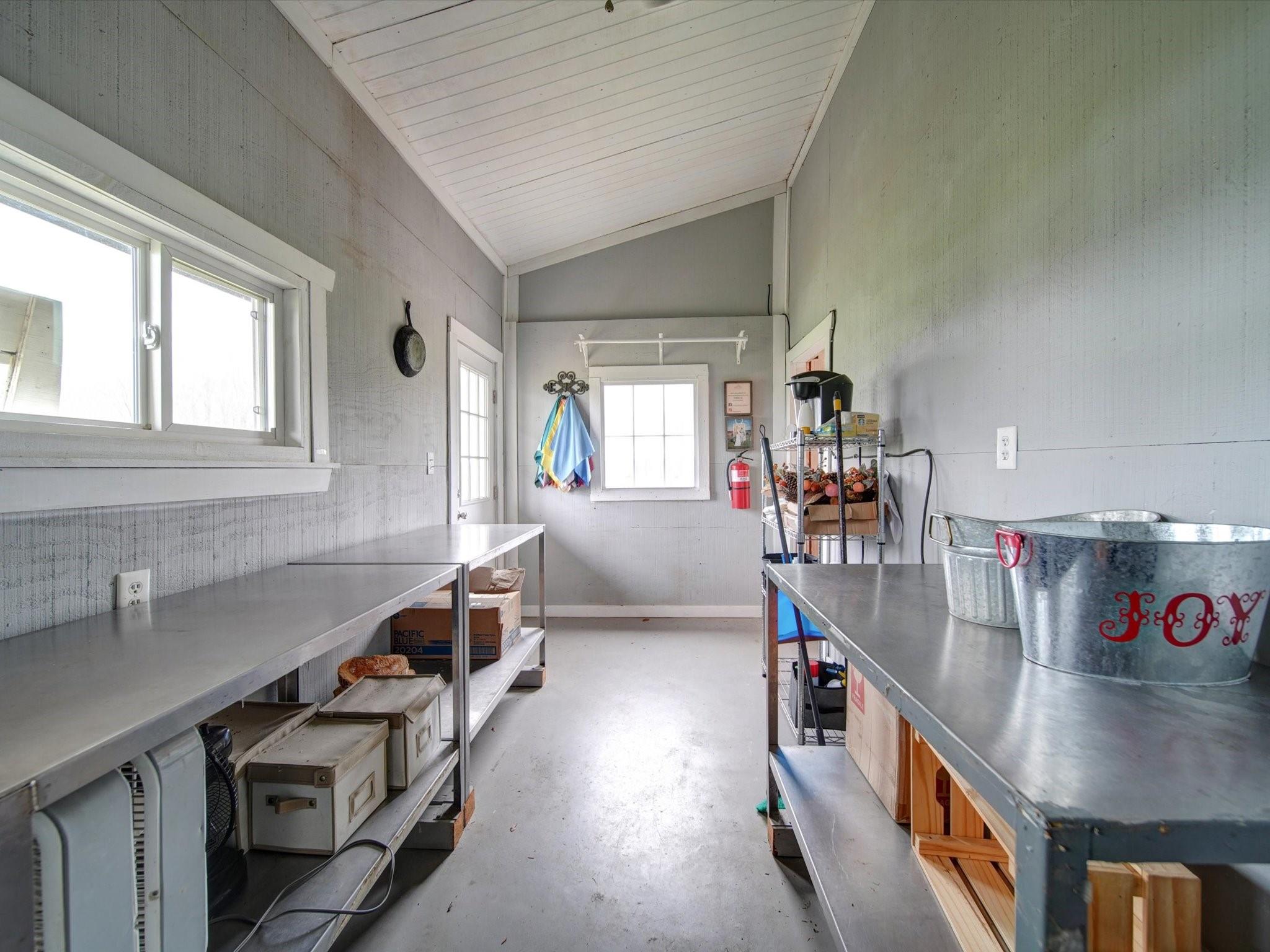 724 Bruce Thomas Road Monroe, NC 28112 - Photo 21 of 47 a kitchen with stainless steel appliances a stove a sink and a refrigerator