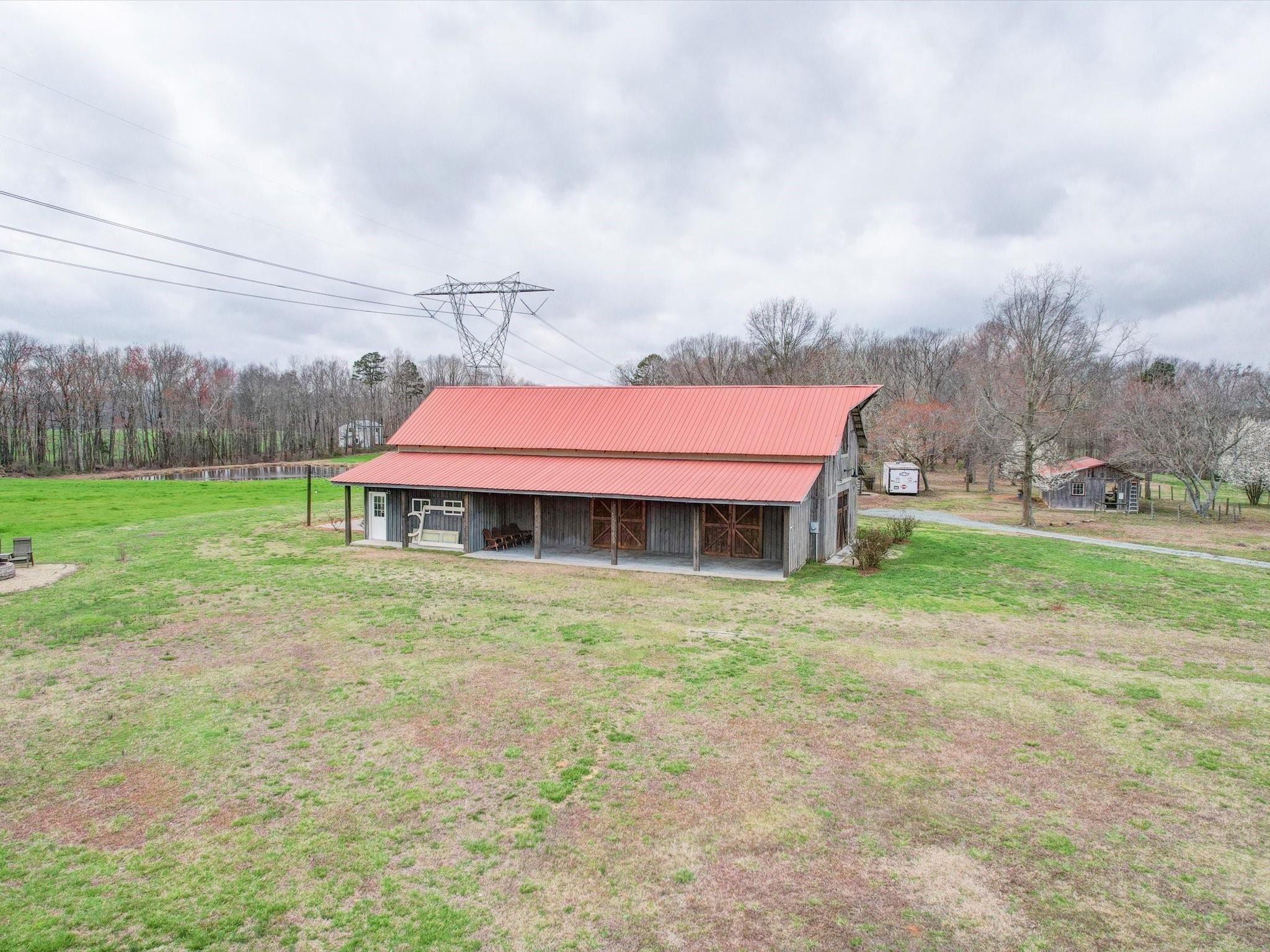 724 Bruce Thomas Road Monroe, NC 28112 - Photo 28 of 47 a backyard of a house with table and chairs