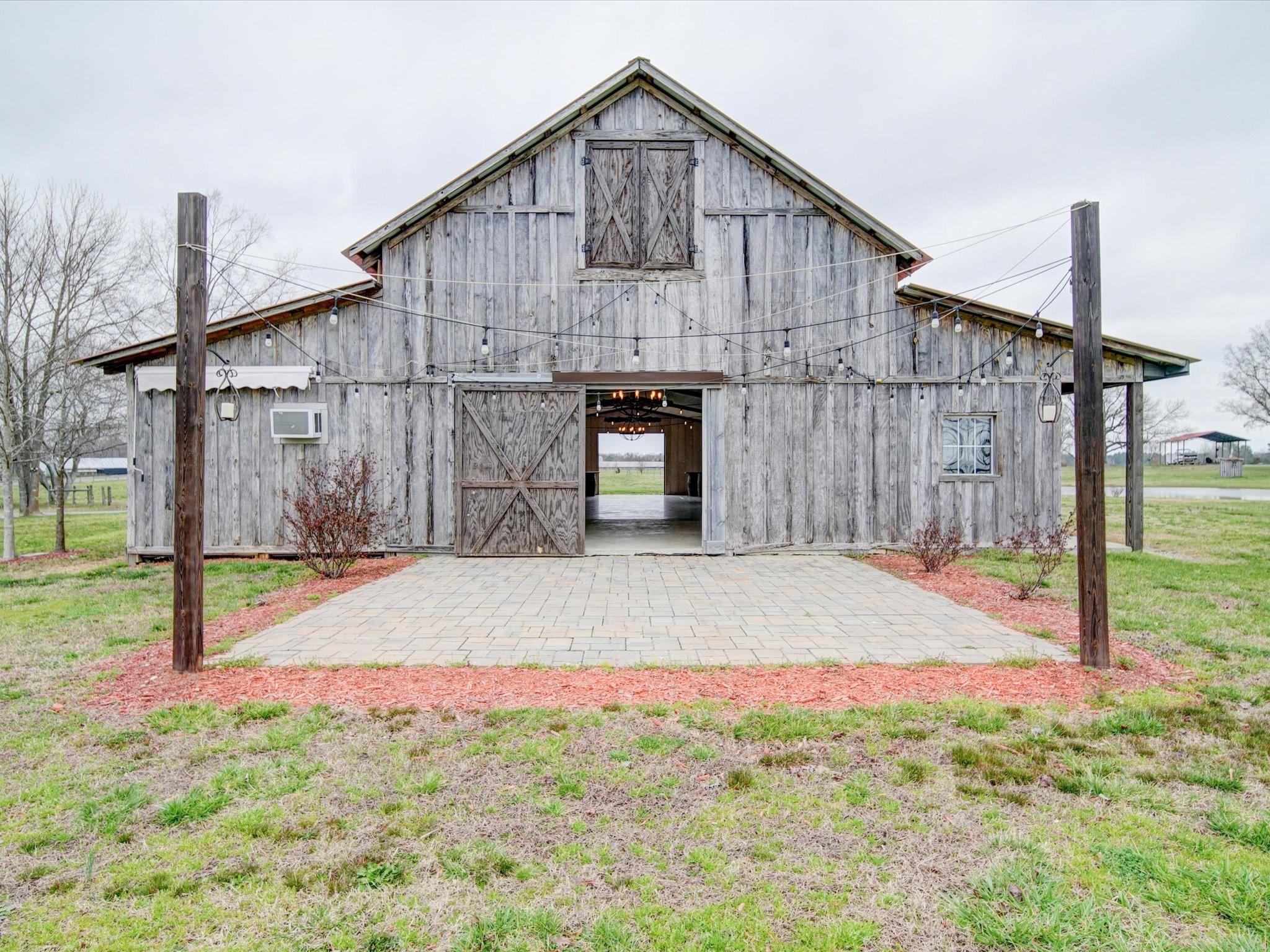 724 Bruce Thomas Road Monroe, NC 28112 - Photo 29 of 47 a front view of a house with garden