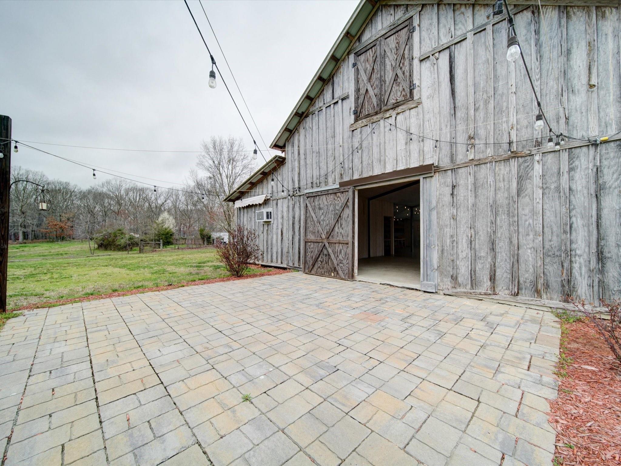 724 Bruce Thomas Road Monroe, NC 28112 - Photo 30 of 47 a view of a entrance gate of the house with a yard