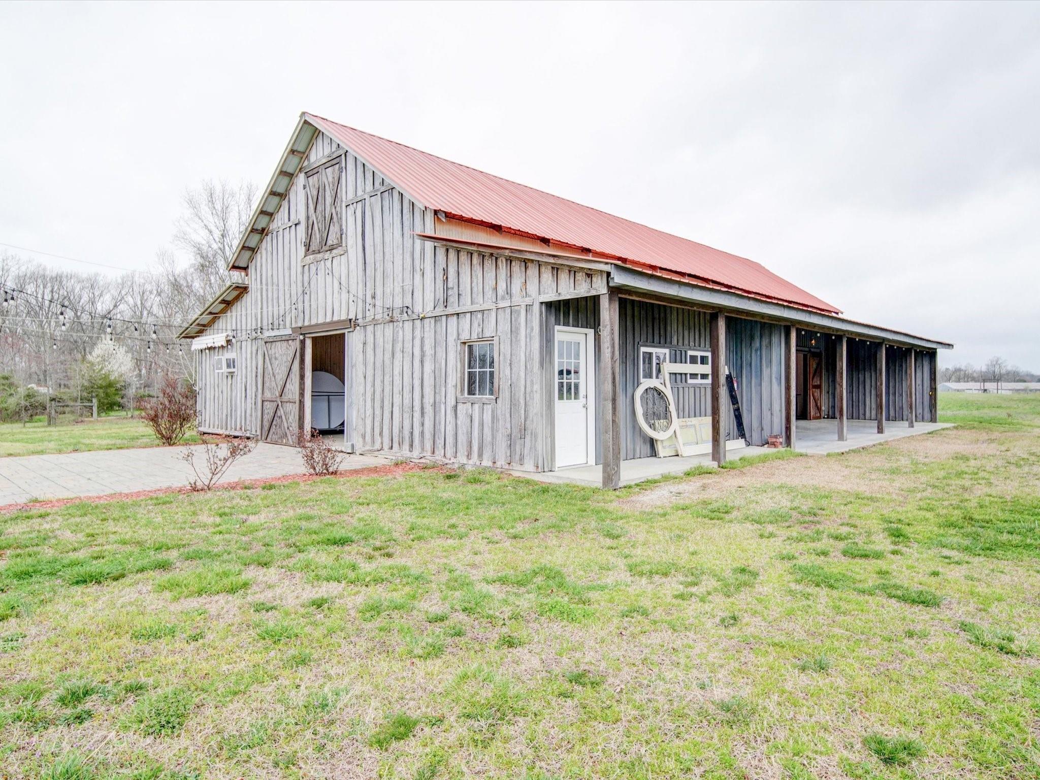 724 Bruce Thomas Road Monroe, NC 28112 - Photo 32 of 47 a front view of a house with garage