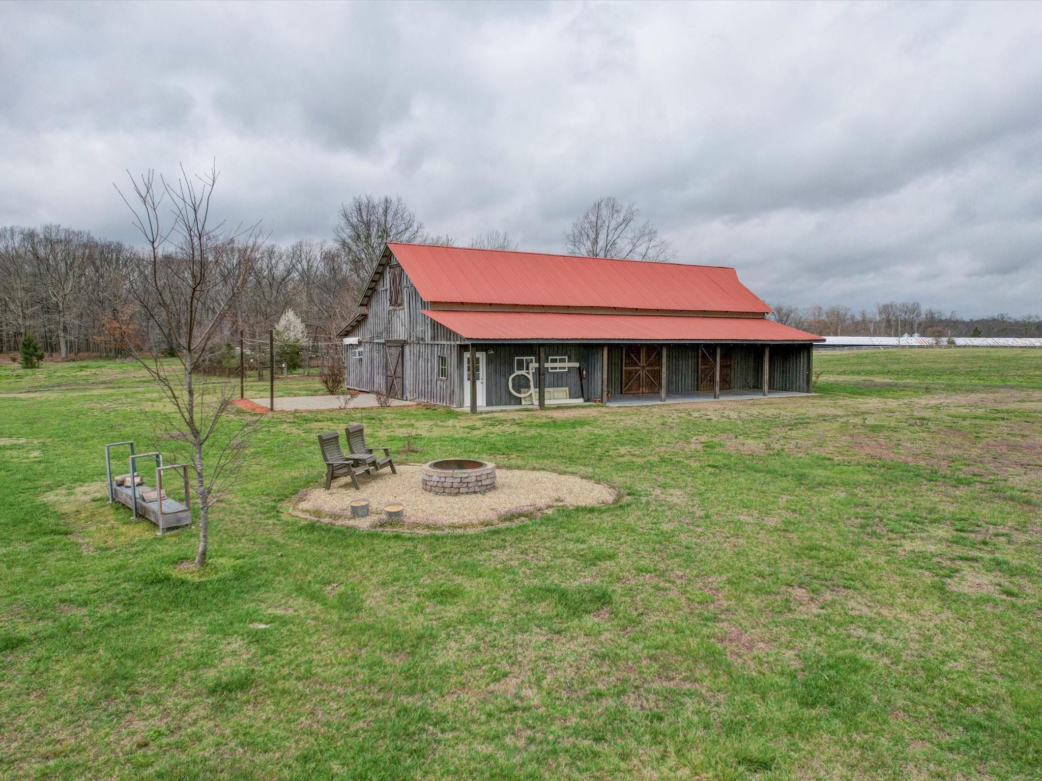 724 Bruce Thomas Road Monroe, NC 28112 - Photo 34 of 47 a backyard of a house with table and chairs