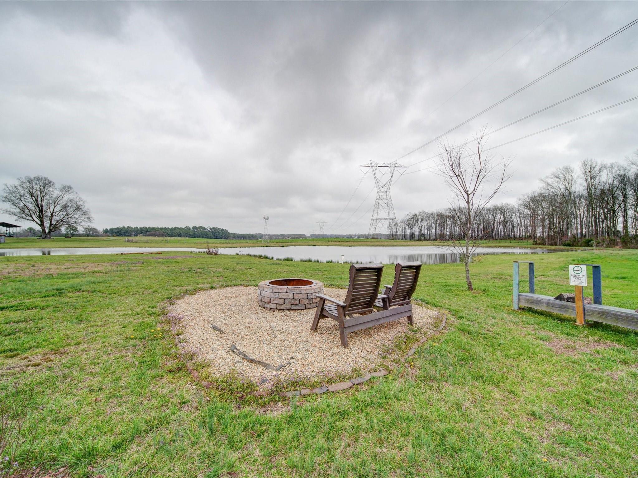 724 Bruce Thomas Road Monroe, NC 28112 - Photo 36 of 47 a view of a swimming pool with a garden and seating area
