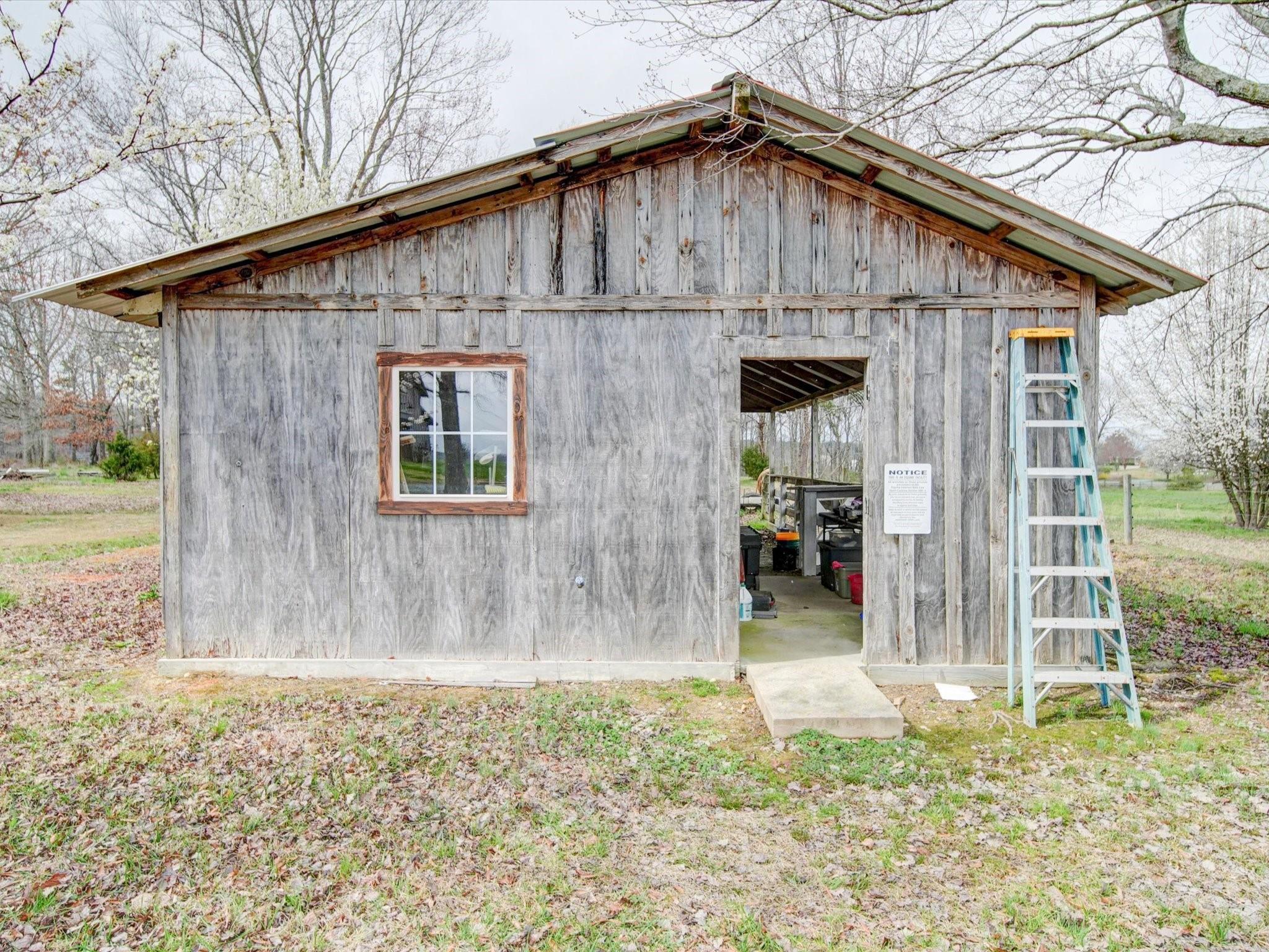 724 Bruce Thomas Road Monroe, NC 28112 - Photo 37 of 47 a backyard of a house with table and chairs