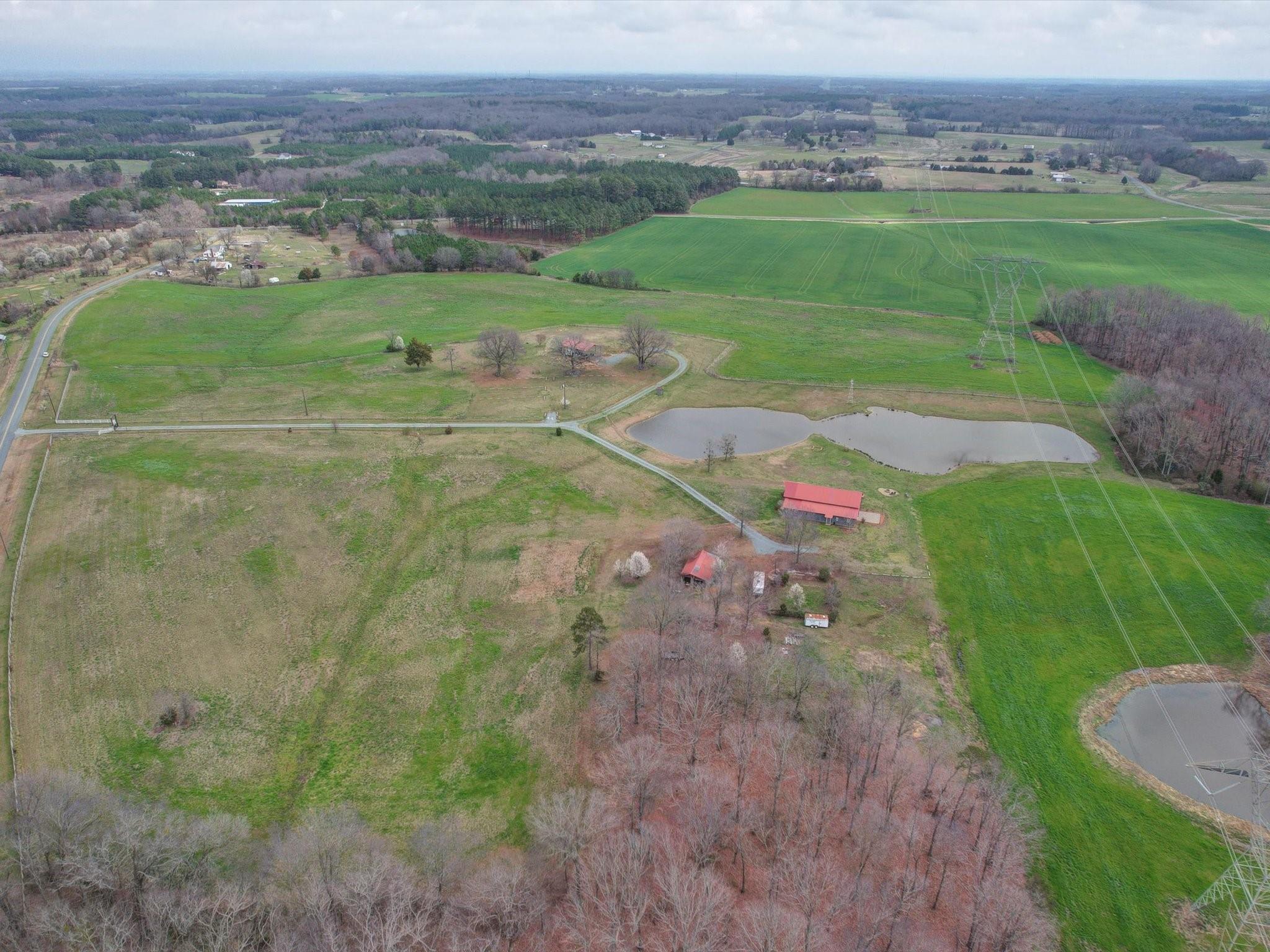 724 Bruce Thomas Road Monroe, NC 28112 - Photo 39 of 47 an aerial view of a houses with outdoor space and trees