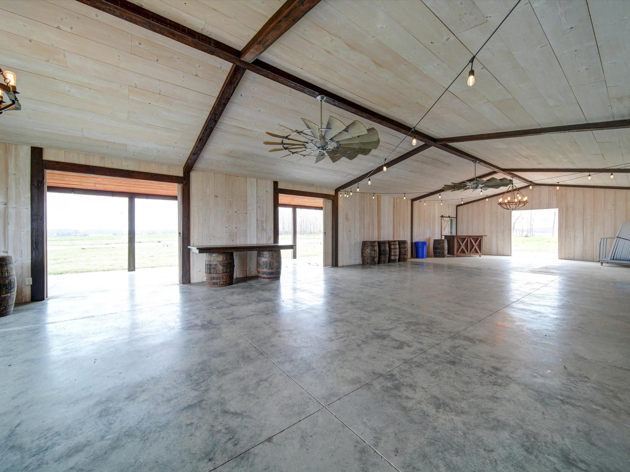 724 Bruce Thomas Road Monroe, NC 28112 - Photo 9 of 47 a view of a livingroom with furniture staircase and a ceiling fan